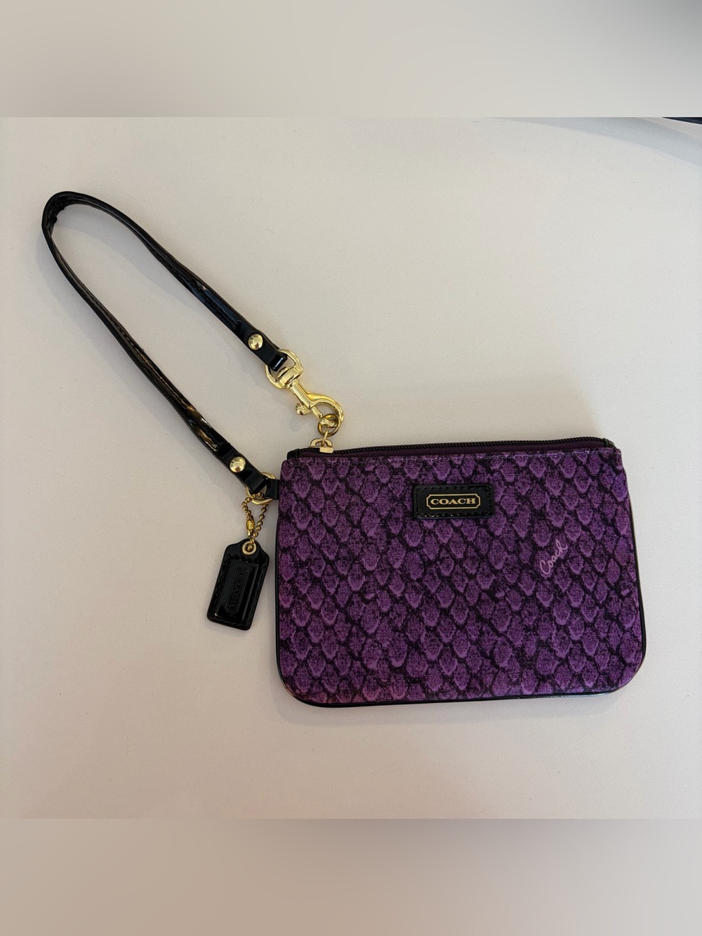 Coach Taylor Snake Print Wristlet in purple and black patent leather wrist strap